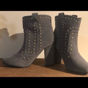 Grey women’s booties size 7  with gold accent